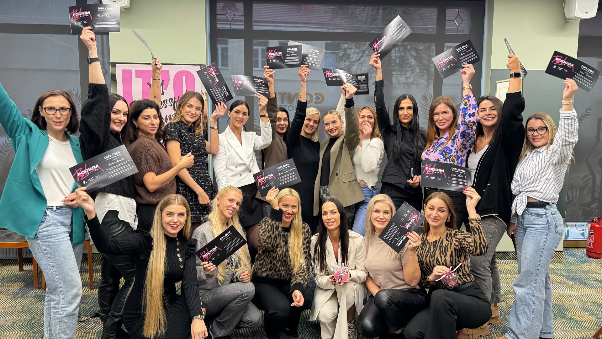 Graduates celebrating with their permanent makeup diplomas